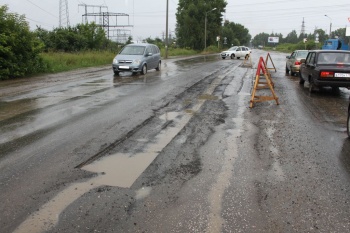 Дождь. В Чайковском начался ремонт дорог 
